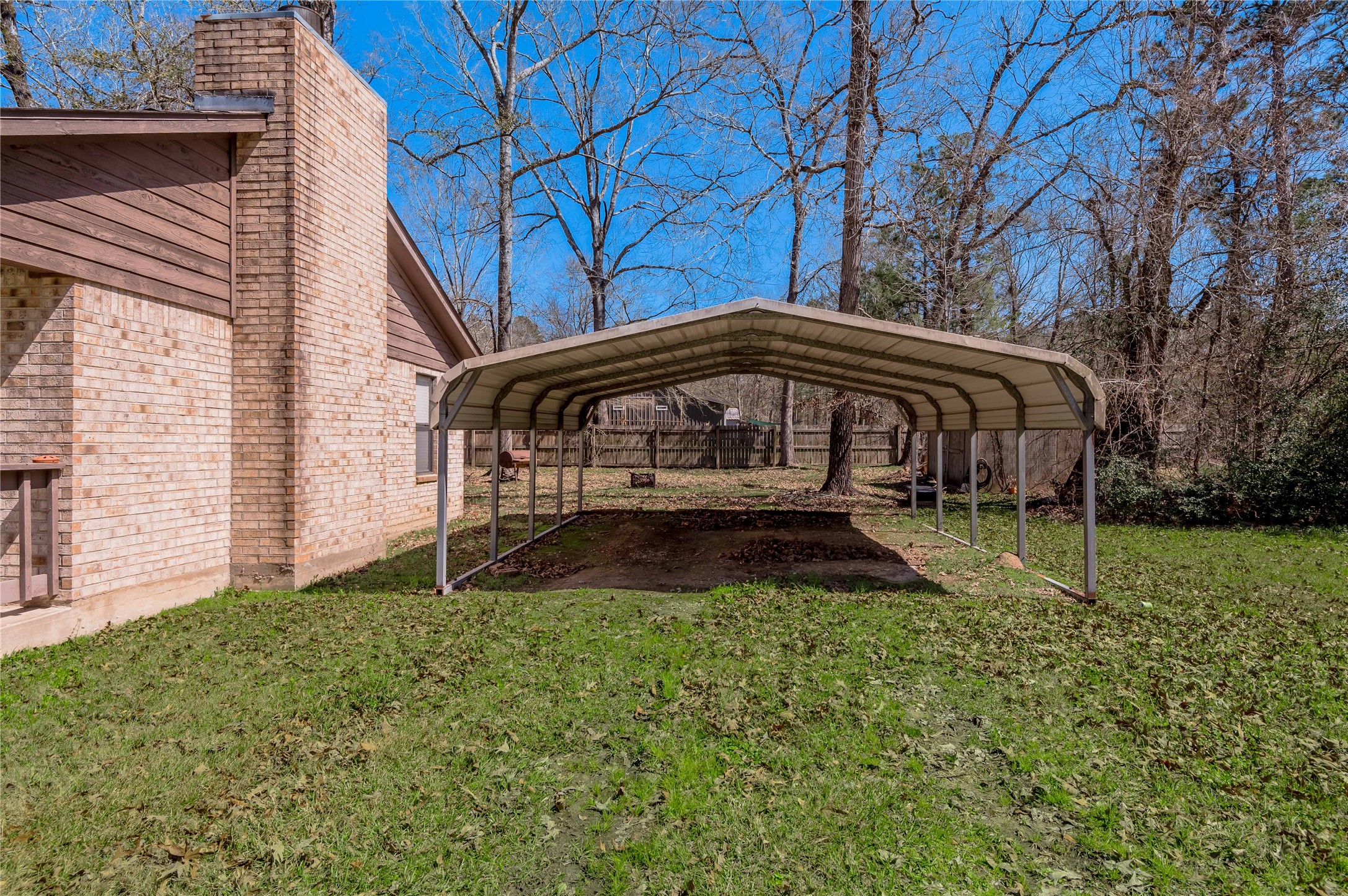 2 Brown Road Huntsville, TX 77320 - Photo 23 of 28 a view of house with a yard