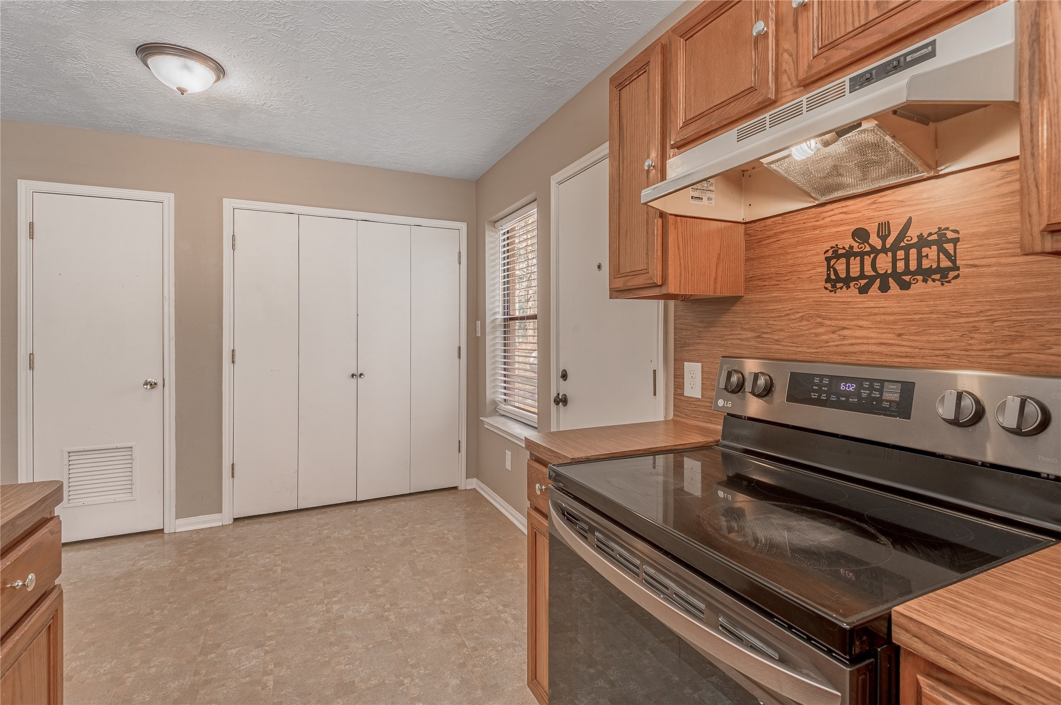 2 Brown Road Huntsville, TX 77320 - Photo 8 of 28 a stove top oven sitting inside of a kitchen