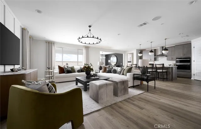 a living room with fireplace furniture and a flat screen tv