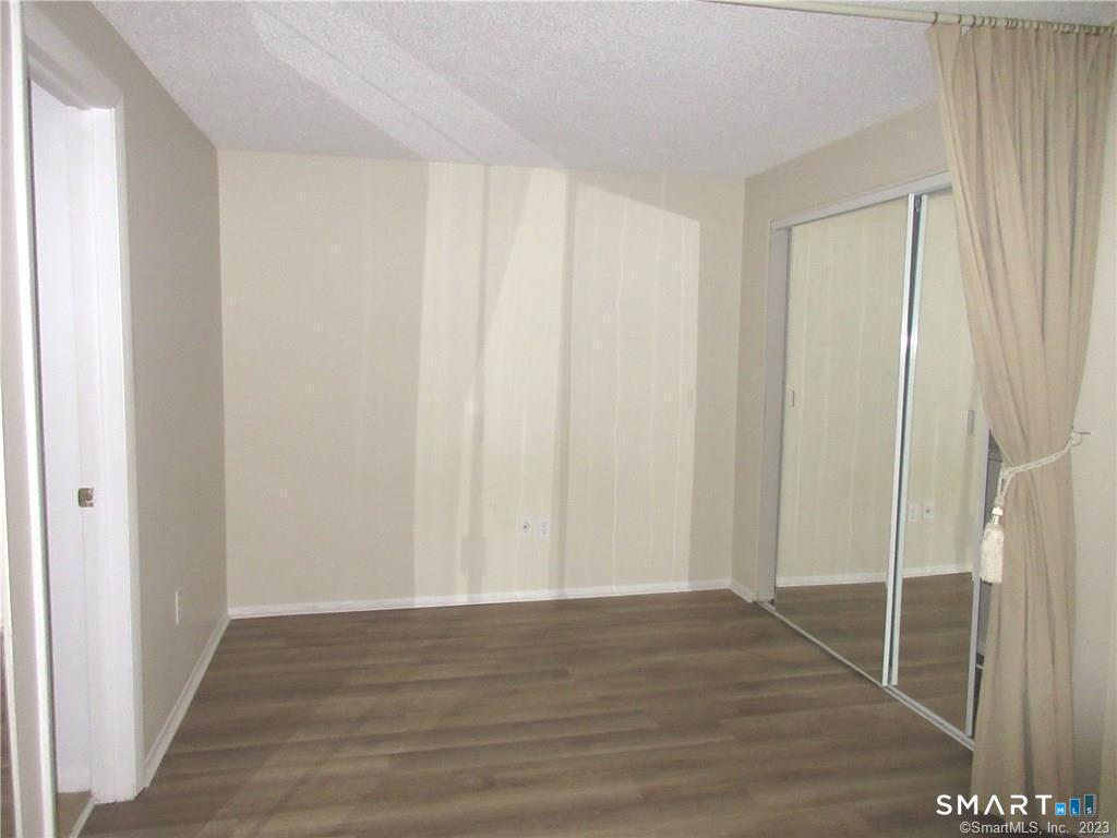 5 Nabby Road, Unit A51 Danbury, CT 06811 - Photo 7 of 13 a view of a room with wooden floor