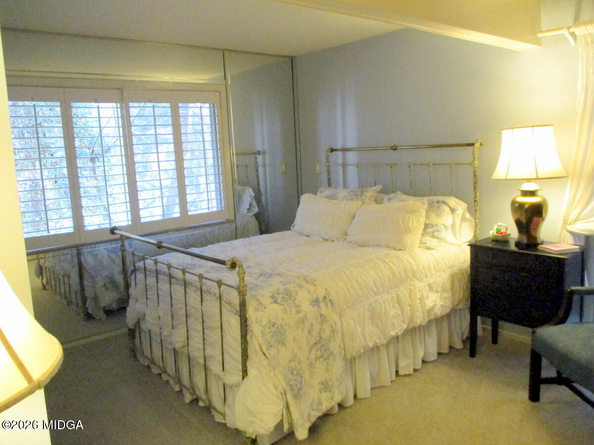 1121 South Jackson Springs Road Macon, GA 31211 - Photo 24 of 29 a bedroom with a bed and a window