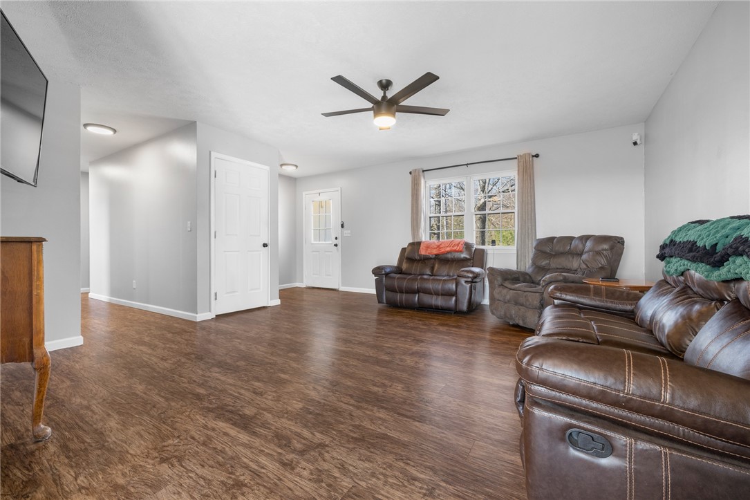 10974 Ricks Drive Harrison, AR 72601 - Photo 16 of 59 Living area with dark wood-style flooring and a ceiling fan
