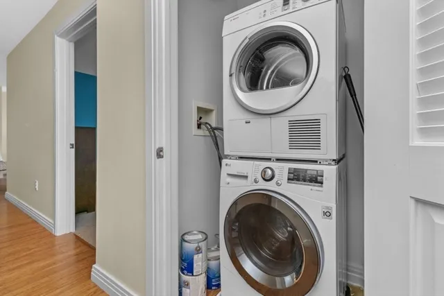 a view of a hallway with washer and dryer