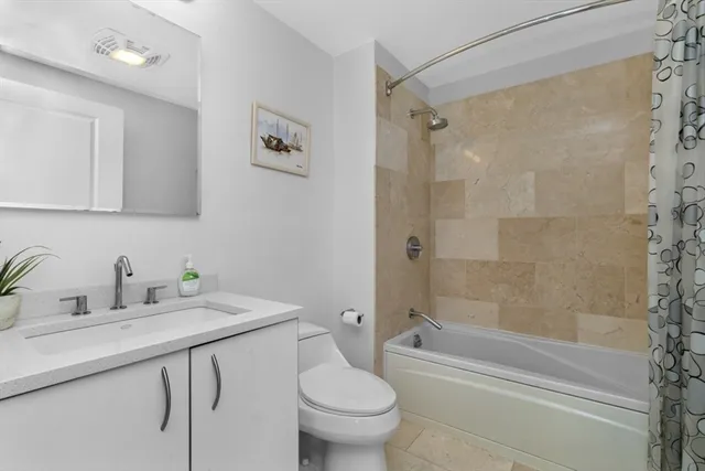 a bathroom with a sink a toilet and a bathtub