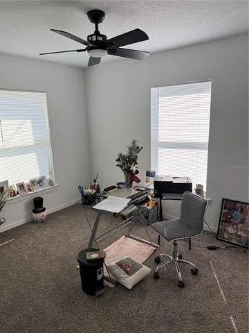 a room with gym equipment and a window