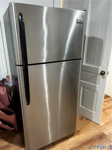 a view of a refrigerator in kitchen