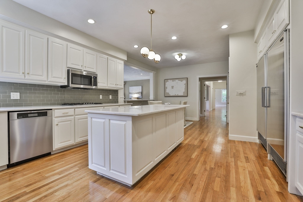 5 Stanton Circle Boxford, MA 01921 - Photo 13 of 42 a kitchen with kitchen island granite countertop a sink cabinets and stainless steel appliances