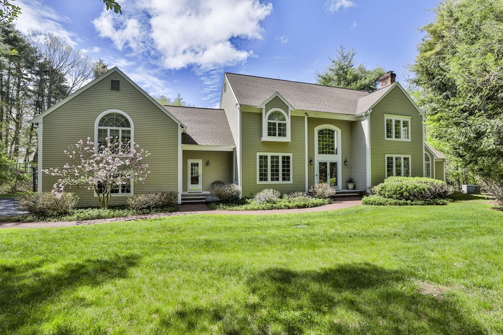 5 Stanton Circle Boxford, MA 01921 - Photo 2 of 42 a front view of a house with a yard and garage