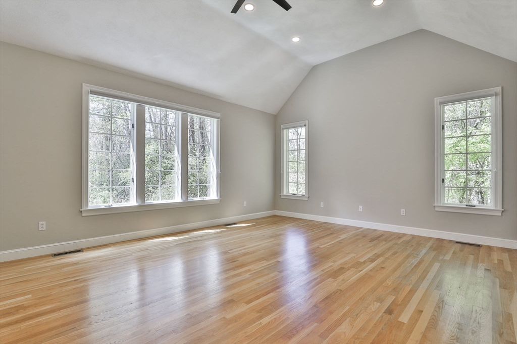 5 Stanton Circle Boxford, MA 01921 - Photo 23 of 42 an empty room with wooden floor and windows