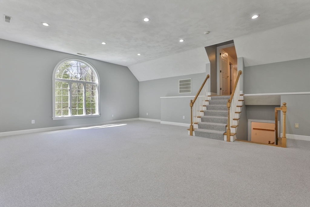 5 Stanton Circle Boxford, MA 01921 - Photo 26 of 42 an empty room with stairs and windows