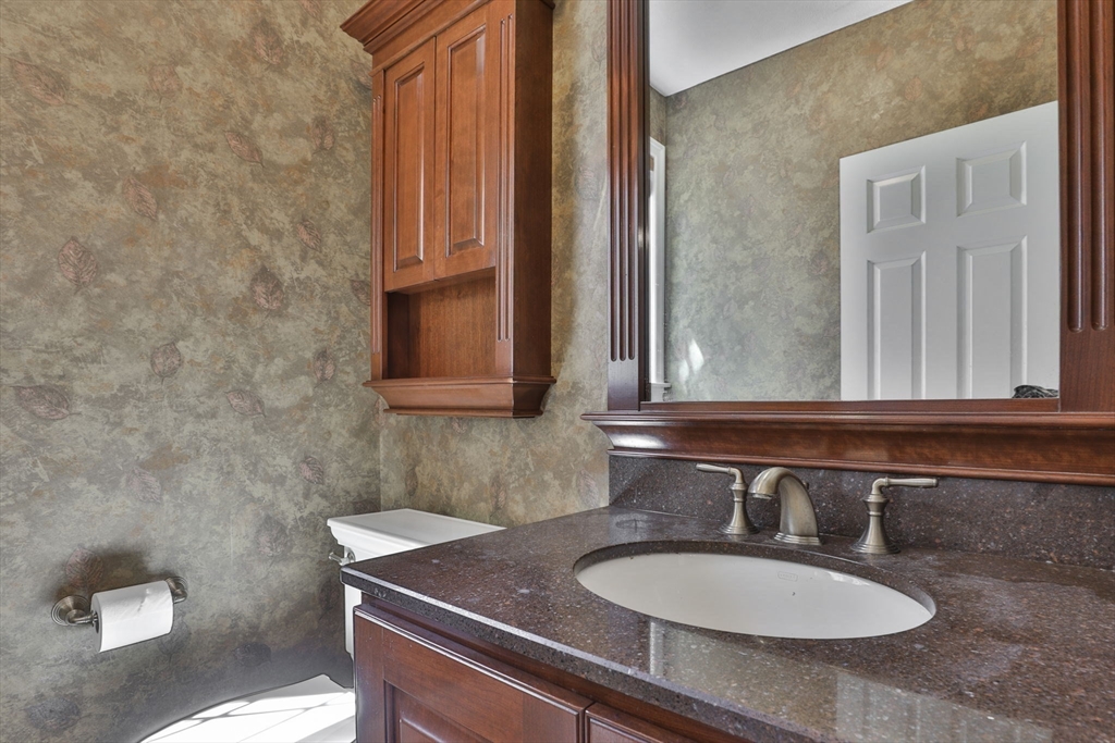 5 Stanton Circle Boxford, MA 01921 - Photo 28 of 42 a bathroom with a sink and a mirror