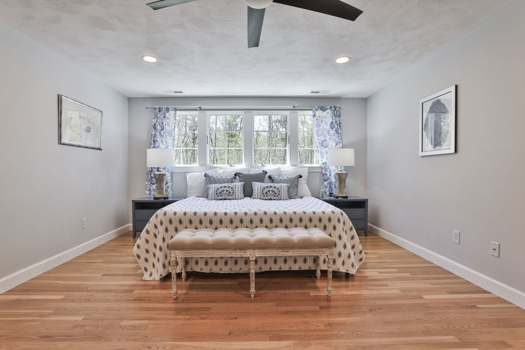 5 Stanton Circle Boxford, MA 01921 - Photo 29 of 42 a large white bed in a large room