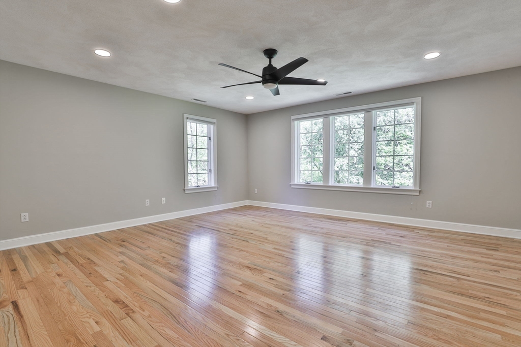 5 Stanton Circle Boxford, MA 01921 - Photo 33 of 42 a view of an empty room with wooden floor and a window