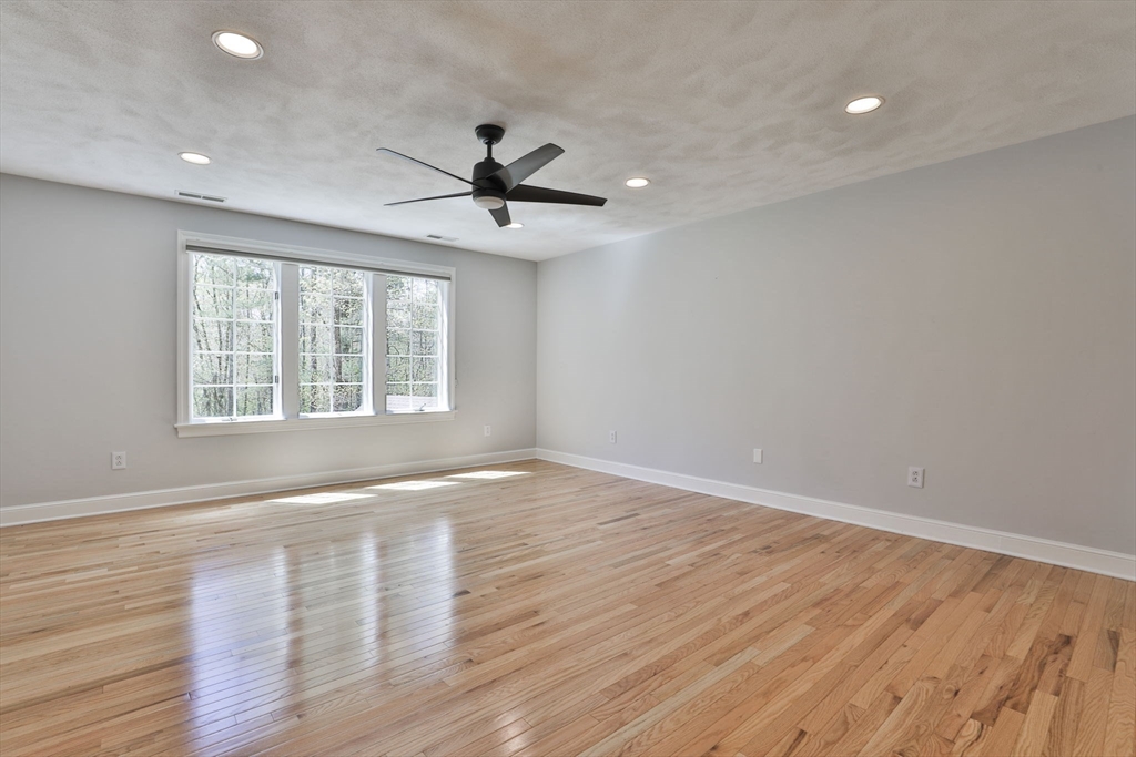 5 Stanton Circle Boxford, MA 01921 - Photo 34 of 42 a view of an empty room with wooden floor and a window