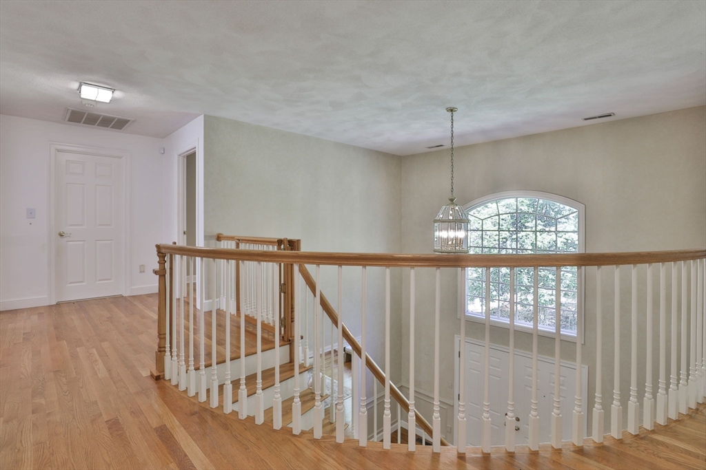 5 Stanton Circle Boxford, MA 01921 - Photo 37 of 42 a view of entryway and hall with wooden floor