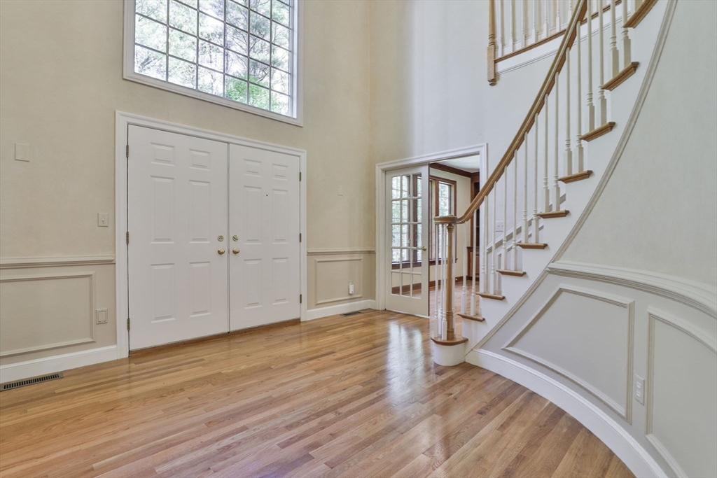 5 Stanton Circle Boxford, MA 01921 - Photo 38 of 42 a view of entryway with wooden floor and stairs