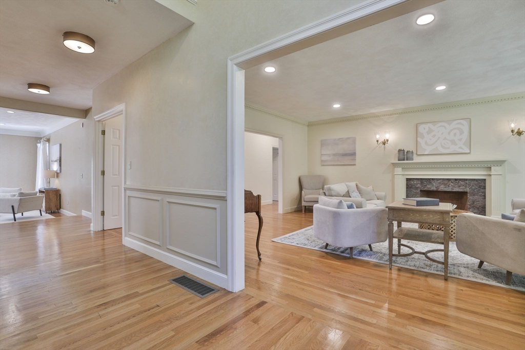 5 Stanton Circle Boxford, MA 01921 - Photo 4 of 42 a living room with furniture or wooden floor and a fireplace