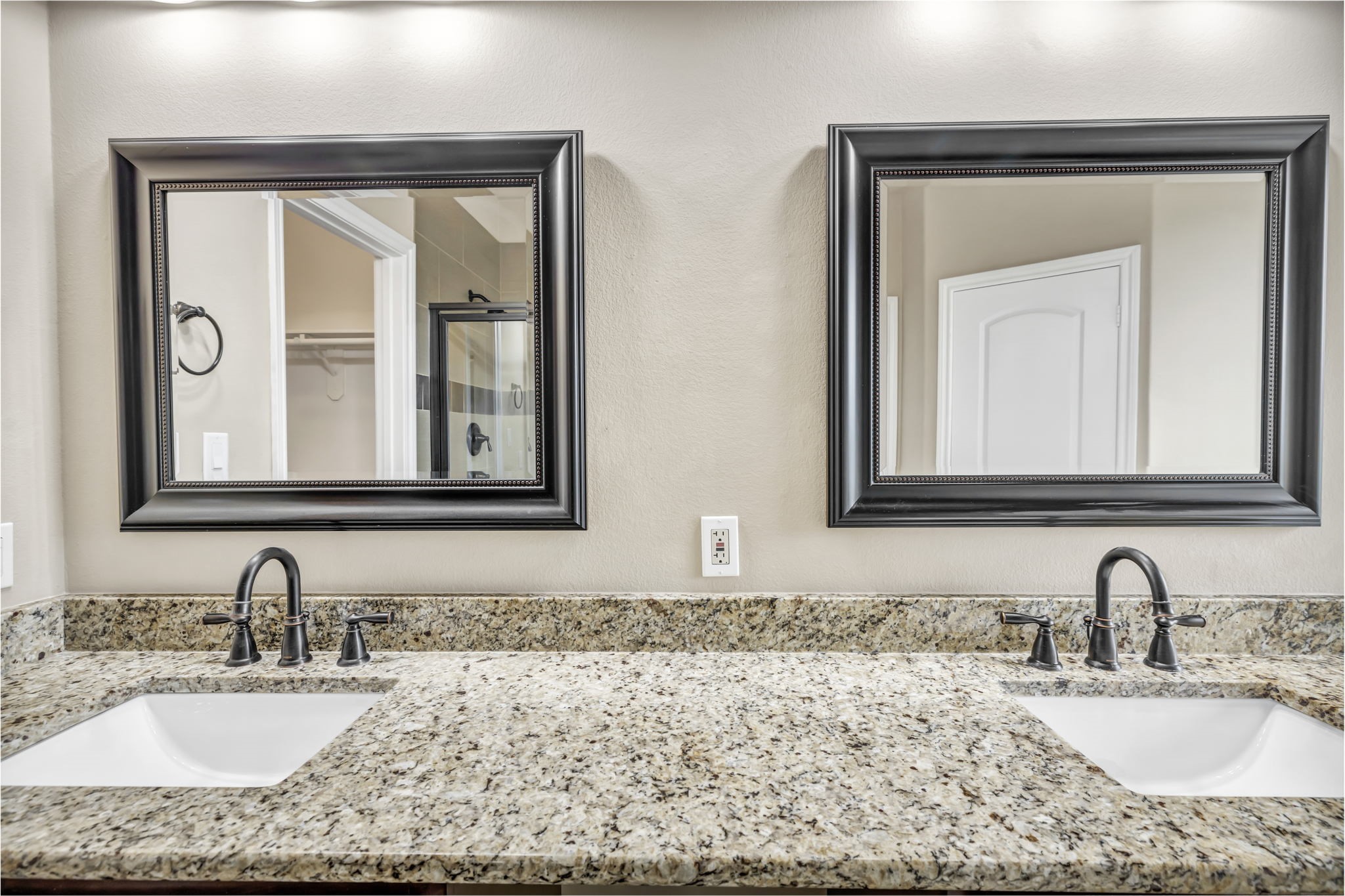 206 Sunrise Ridge Cove Austin, TX 78738 - Photo 13 of 38 a bathroom with a granite countertop sink a mirror and a window