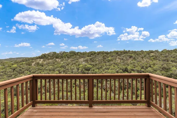 a balcony with wooden floor in view