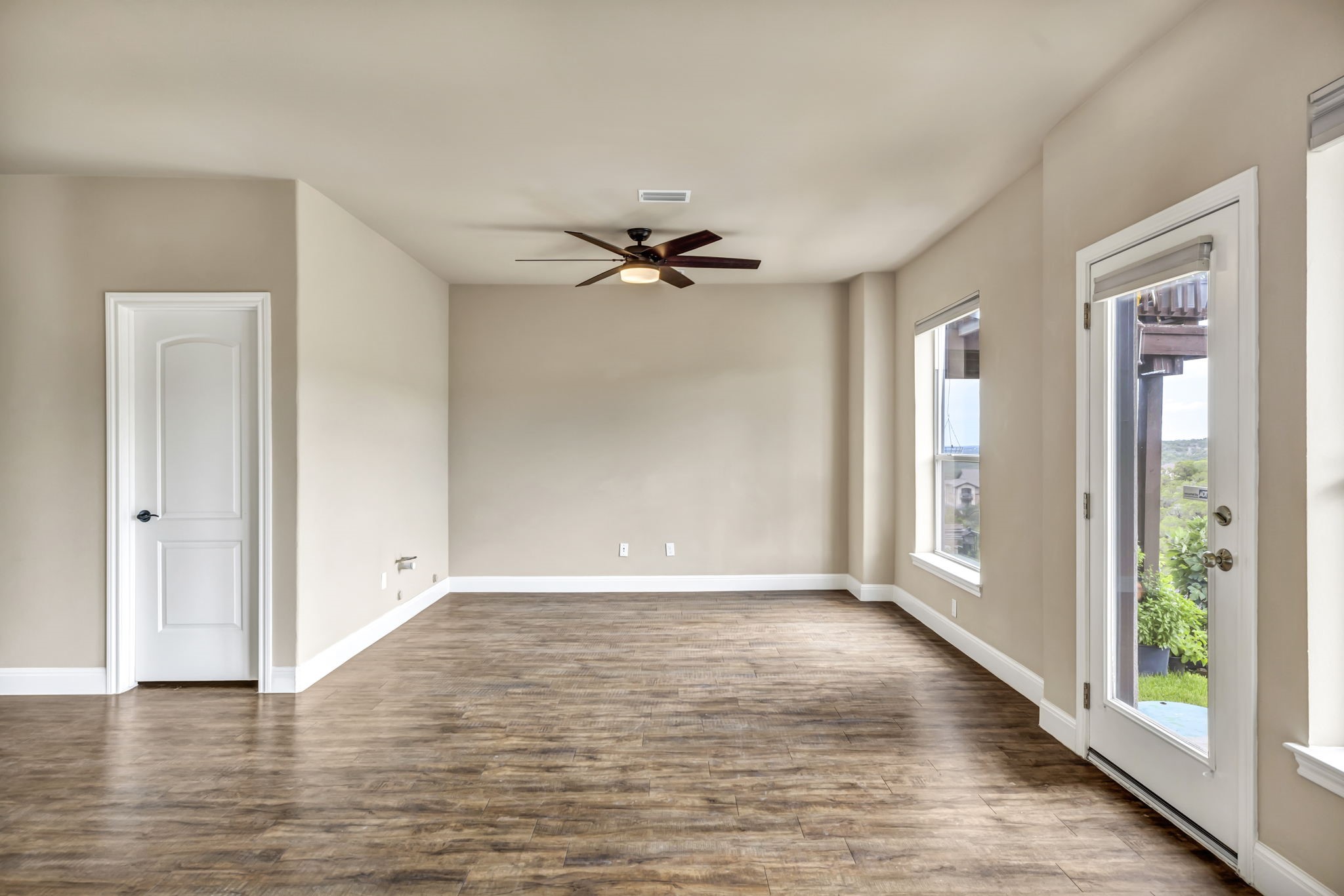 206 Sunrise Ridge Cove Austin, TX 78738 - Photo 25 of 38 a view of a livingroom with a ceiling fan and window