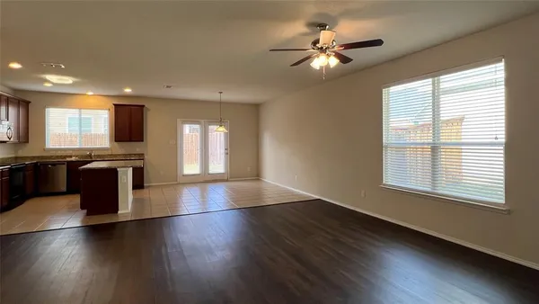 a view of a kitchen with sink and a large window
