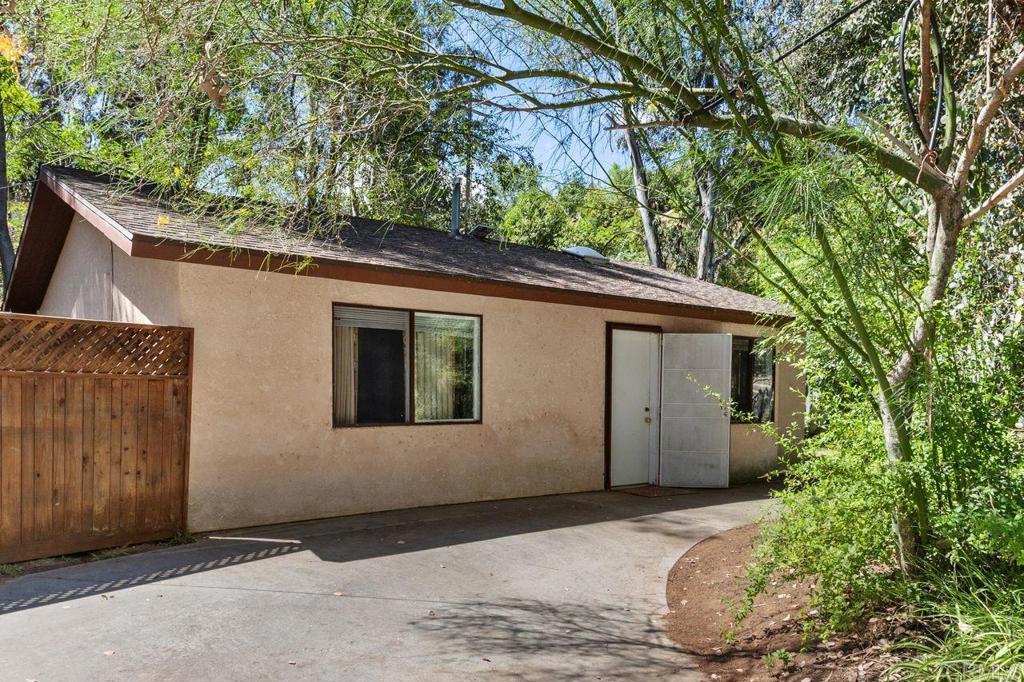 29560 Lilac Road Valley Center, CA 92082 - Photo 5 of 43 a view of a house with a large tree
