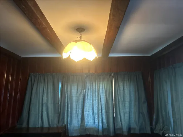 a bathroom with a toilet a sink and a mirror