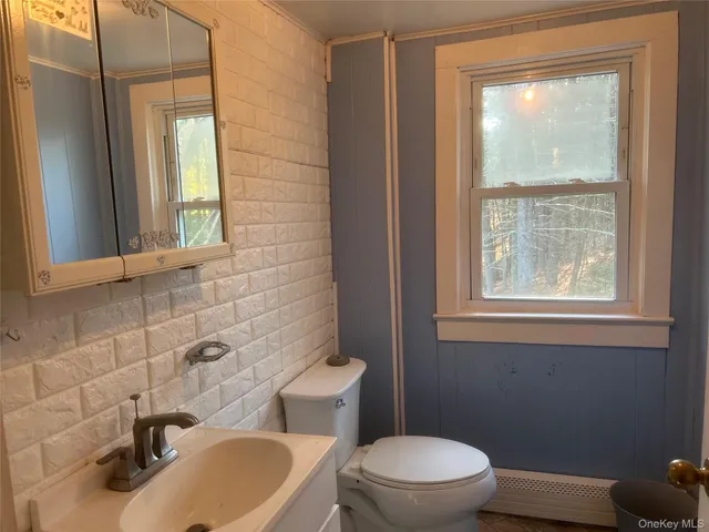 an empty room with a empty space and windows