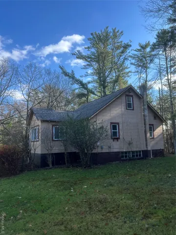 a view of a house with a back yard