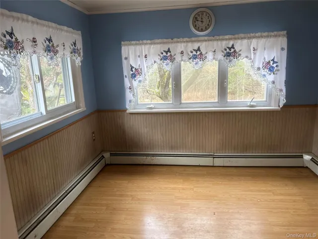 a view of a room with window and bed