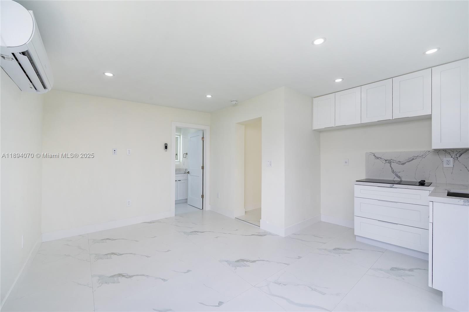 975 Southwest 89th Avenue Miami, FL 33174 - Photo 15 of 17 a view of a kitchen with white cabinets