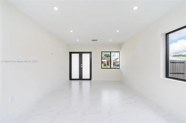 an empty room with windows