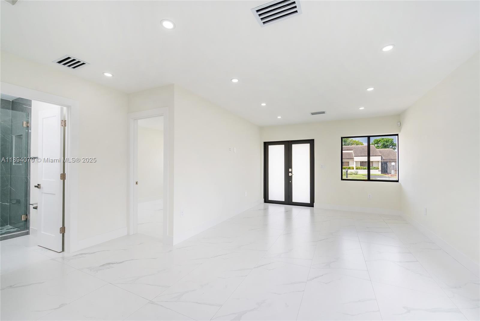 975 Southwest 89th Avenue Miami, FL 33174 - Photo 6 of 17 an empty room with windows and closet