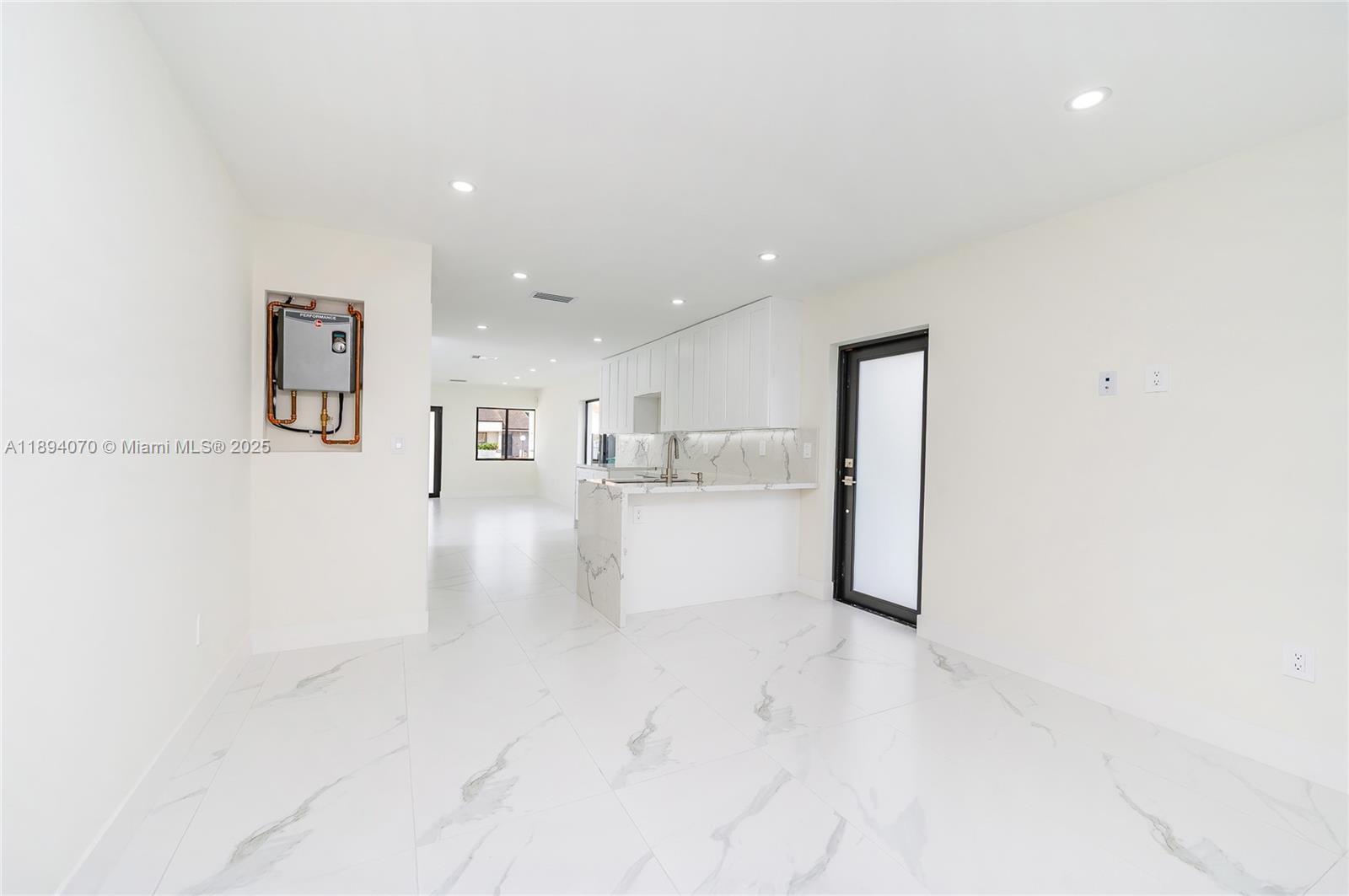 975 Southwest 89th Avenue Miami, FL 33174 - Photo 7 of 17 a view of kitchen with furniture and refrigerator