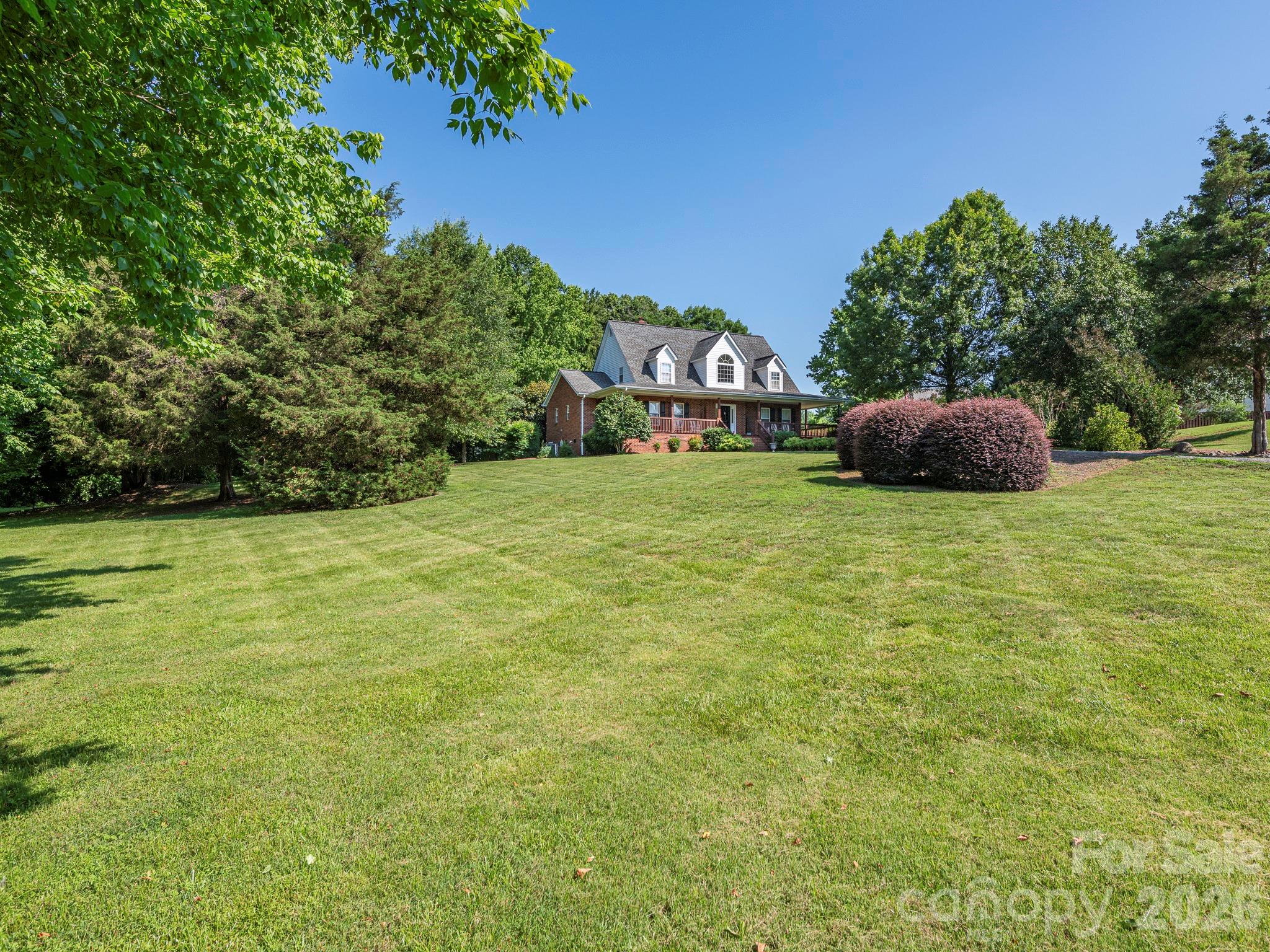 4440 Hucks Road Charlotte, NC 28269 - Photo 45 of 45 a backyard of a house with lots of green space