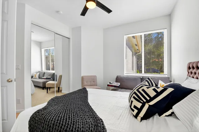 a bathroom with a tub a sink and a window