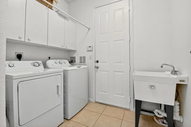an aerial view of a resort with swimming pool and ocean view
