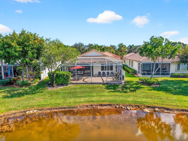 a view of a swimming pool with an outdoor seating