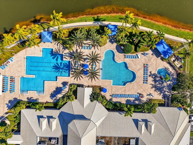 a view of a lake with houses in the back