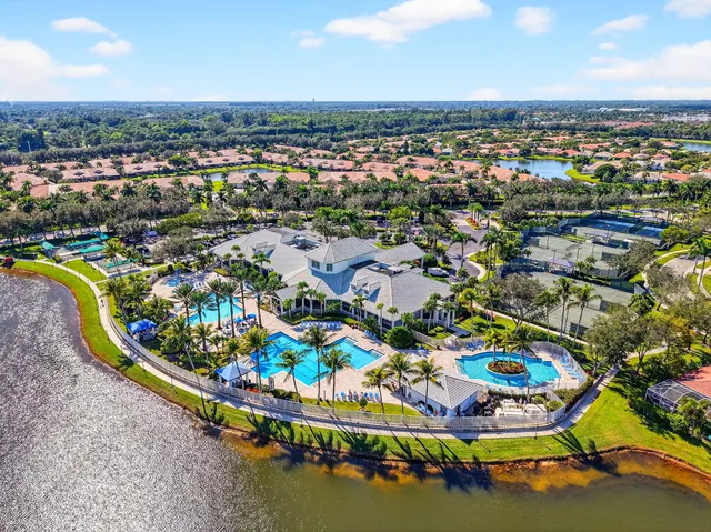 a view of a patio with a table and chairs under an umbrella