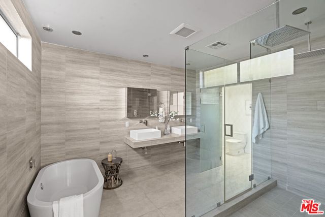 a bathroom with a sink and shower