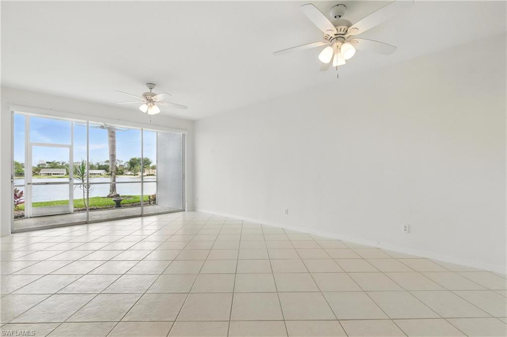 3460 West Crown Pointe Boulevard, Unit 101 Naples, FL 34112 - Photo 17 of 43 a view of an empty room with a window