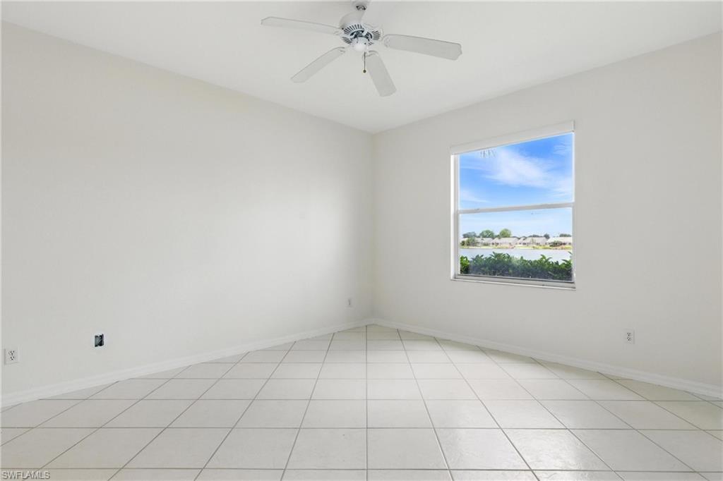 3460 West Crown Pointe Boulevard, Unit 101 Naples, FL 34112 - Photo 18 of 43 a view of an empty room with a window