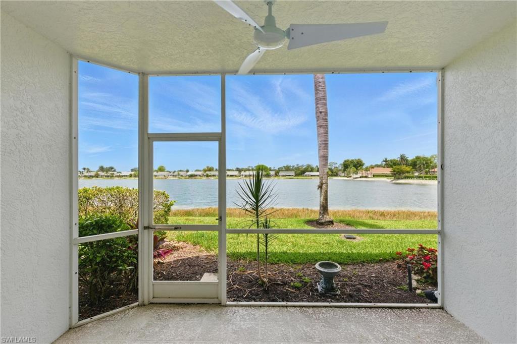 3460 West Crown Pointe Boulevard, Unit 101 Naples, FL 34112 - Photo 2 of 43 a view of a garden with an outdoor seating