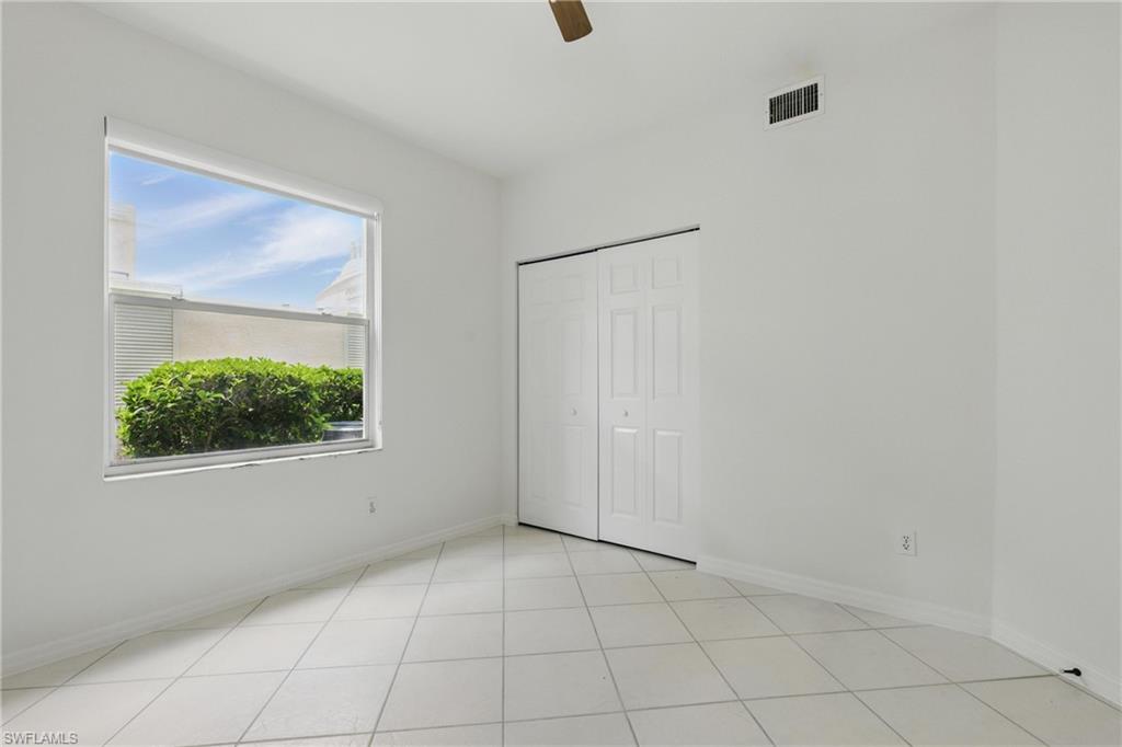 3460 West Crown Pointe Boulevard, Unit 101 Naples, FL 34112 - Photo 27 of 43 a view of an empty room with a window