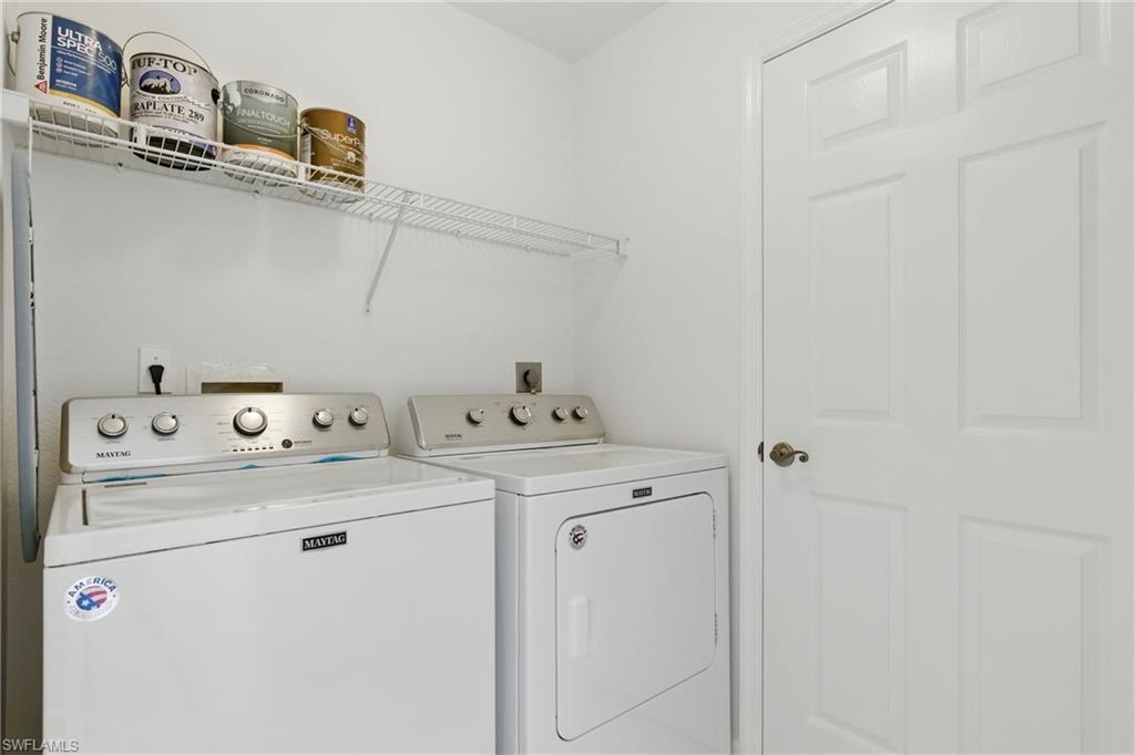 3460 West Crown Pointe Boulevard, Unit 101 Naples, FL 34112 - Photo 30 of 43 a utility room with dryer and washer