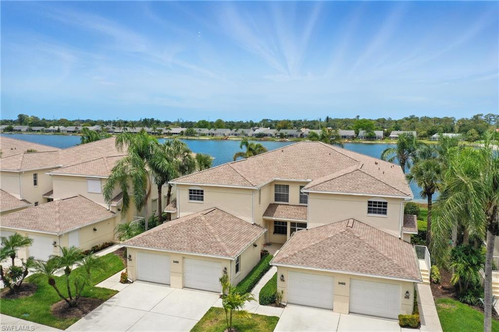 3460 West Crown Pointe Boulevard, Unit 101 Naples, FL 34112 - Photo 34 of 43 an aerial view of a house with a yard