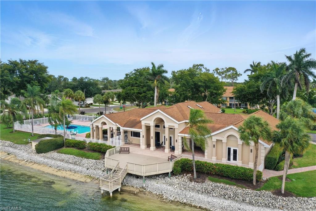 3460 West Crown Pointe Boulevard, Unit 101 Naples, FL 34112 - Photo 40 of 43 an aerial view of a house