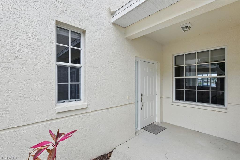3460 West Crown Pointe Boulevard, Unit 101 Naples, FL 34112 - Photo 4 of 43 a view of empty room with windows