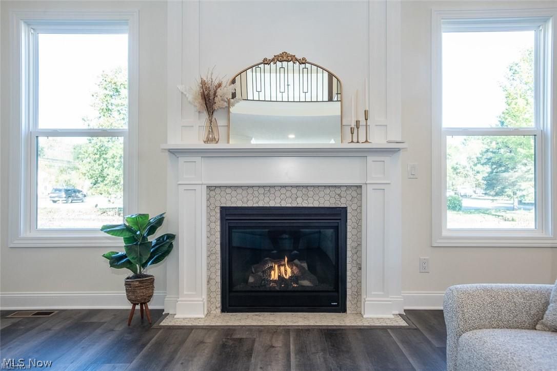 34286 Brookside Lane North Ridgeville, OH 44039 - Photo 12 of 50 Detailed view of wood finished floors and a fireplace